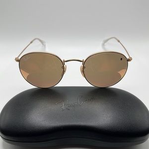 Women’s Ray Ban sunglasses. Round gold metal frames with rose and brown lenses.